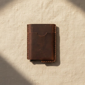 Coffee personalized leather card holder wallet on a neutral linen background