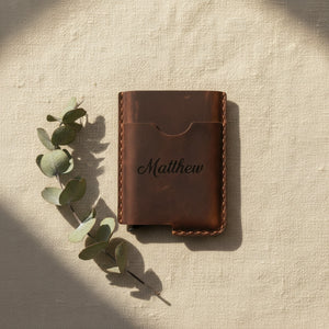 Coffee leather card holder laser-engraved with the name Matthew, with eucalyptus