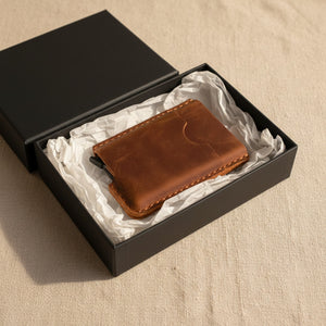 Brown personalized leather card holder presented in a black gift box, gift for him