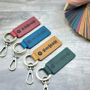 Personalized leather keychain with laser-engraved scannable Spotify code