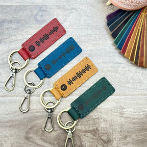 Personalized leather keychain with laser-engraved scannable Spotify code