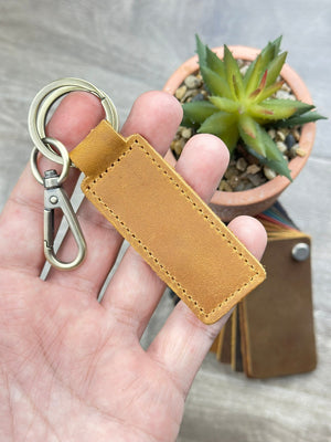 Personalized leather keychain with laser-engraved scannable Spotify code