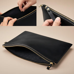 Black leather clutch with gold zipper, interior view