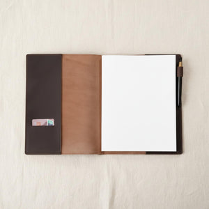 Open brown leather journal cover with inner card pocket and pen holder